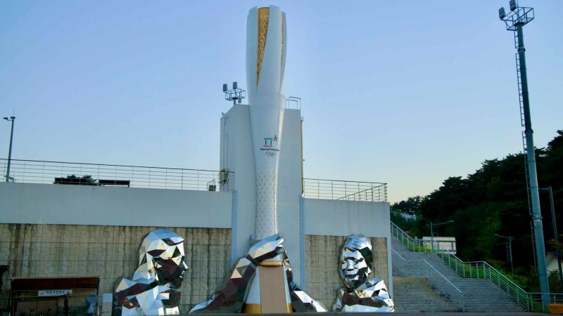 Sculptures and the Olympic torch replica at the Gangneung Olympic Museum.
