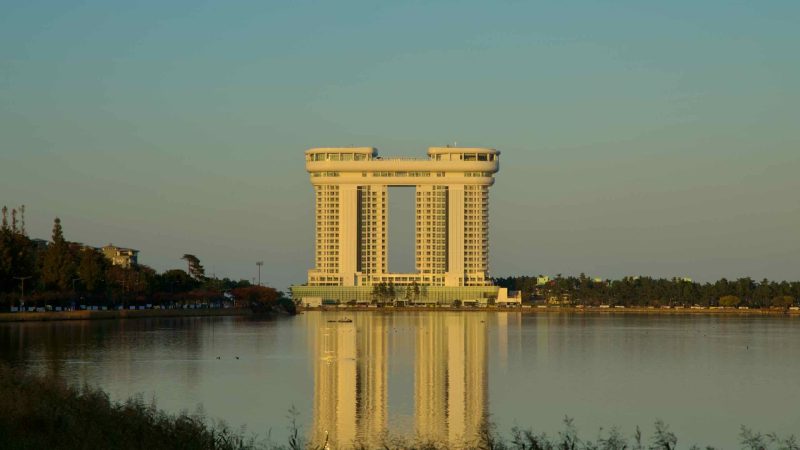 Skybay Hotel Gyeongpo is mirrored on the calm waters of Gyeongpo Lake, capturing the serene ambiance of this scenic area.