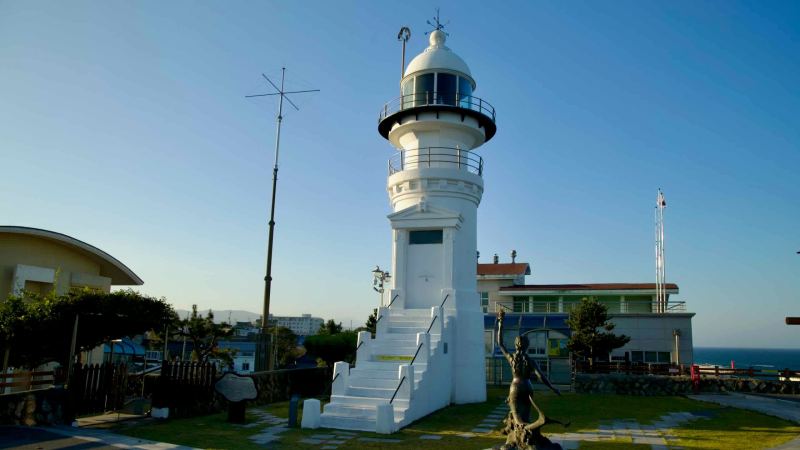 Jumunjin Lighthouse stands over the coast north of Jumunjin Port.