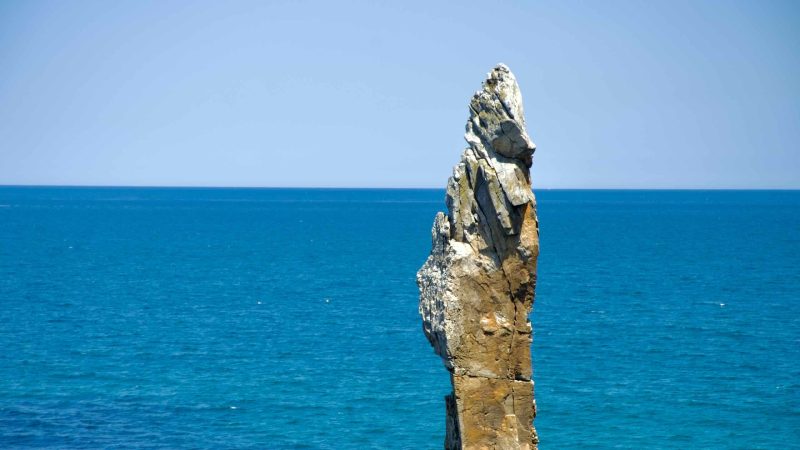 A view of the iconic Chuam Candlestick Rock against the vast blue expanse of the East Sea.