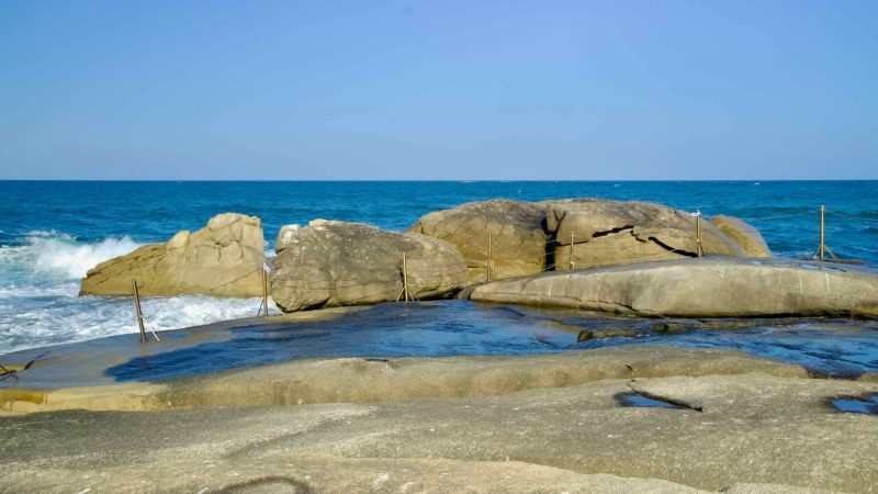 The Avalokitesvara Rock at Yeonhwadae, a natural coastal formation revered for its resemblance to the Bodhisattva of Compassion, overlooks the East Sea.