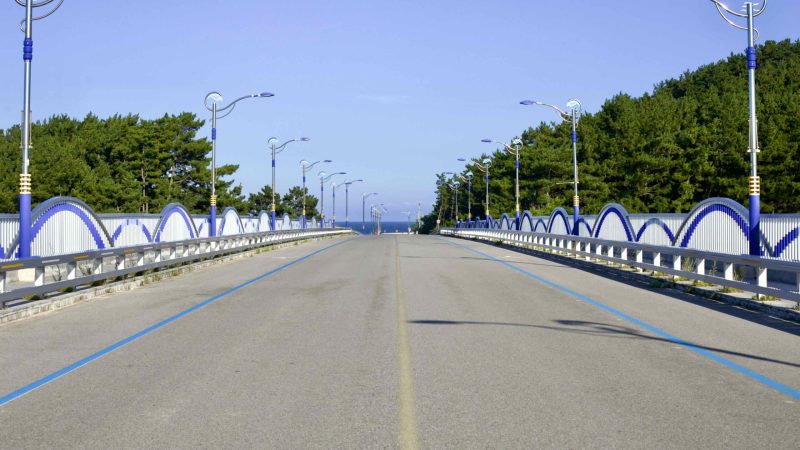 A picture of Wolsong Pavilion Bridge (월송정교) crossing Namdae Stream (남대천) in Uljin County, South Korea.