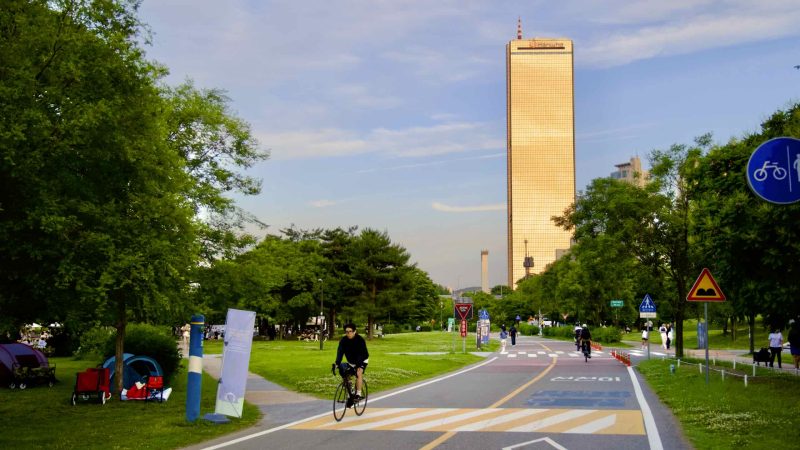 A picture of the cycling paths and 63 Building (63빌딩) in Yeouido Hangang Park (여의도한강공원) in Seoul, South Korea.