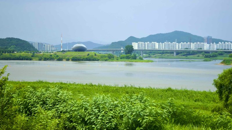 A picture of The ARC Cultural Center (디아크문화관) along the Nakdonggang Bike Path and Nakdong River in Daegu, South Korea.