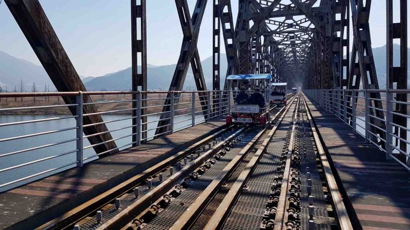 A picture of rail bikes on Sinnakdong Steel Bridge (신낙동강철교) over the Nakdong River (낙동강) between Gimhae and Miryang Cities, South Korea.