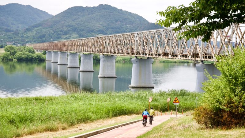 A picture of the Sinnakdong Steel Bridge (신낙동강철교) crossing the Nakdong River (낙동강) on the Nakdonggang Bike Path (낙동강자전거길) between in Miryang and Gimhae Cities, in South Korea.