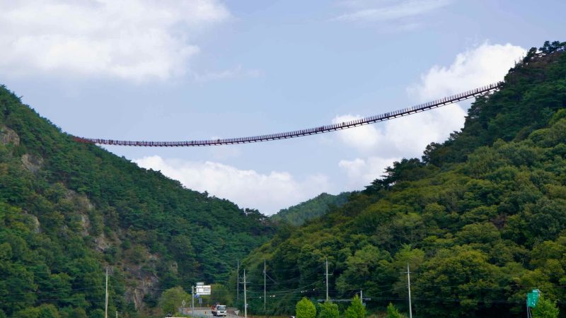 The Chaegye-san Suspension Bridge stretches across a deep mountain valley, connecting the peaks of Chaegye-san.