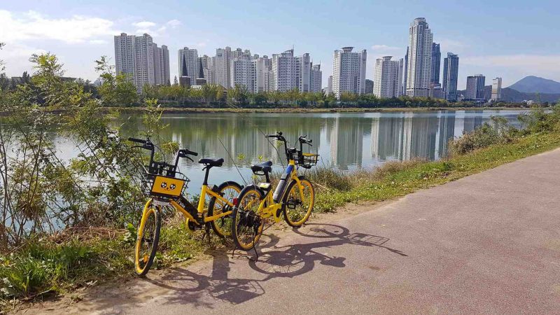 A picture of a Kakao-T bike parked near Taehwa river in Ulsan, South Korea.